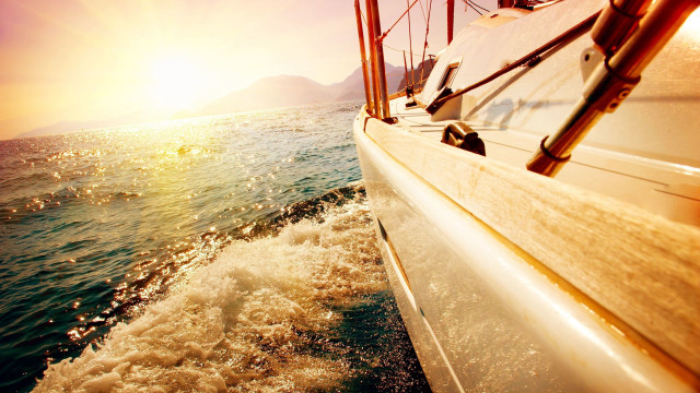 Boat sunset ocean mountains photorealism free wallpaper for desktop - medium preview image