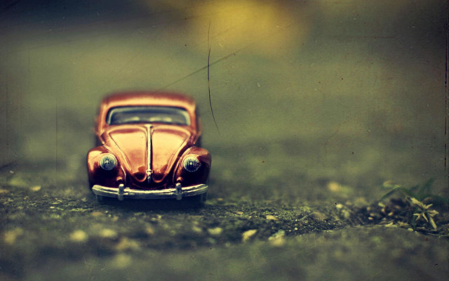 Toy car grass rocks tilt free wallpaper for desktop - medium preview image