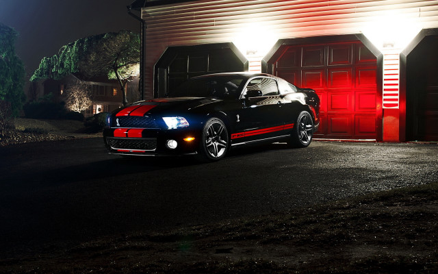 Black car red garage night free wallpaper for desktop - medium preview image