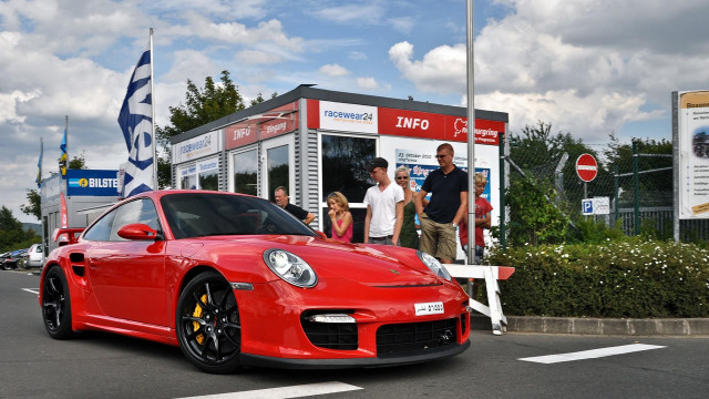 Red sports car booth people free wallpaper for desktop - medium preview image