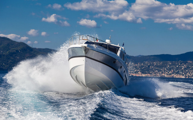 Boat spray cityscape beach sky free wallpaper for desktop - medium preview image