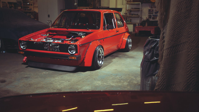 Red car garage junk tires free wallpaper for desktop - medium preview image