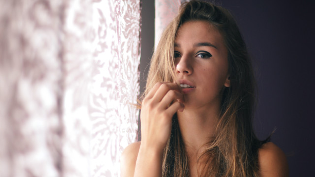 Woman brushing teeth window curtain free wallpaper for desktop - medium preview image