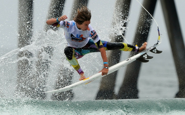 Surfing woman wave pier space free wallpaper for desktop - medium preview image