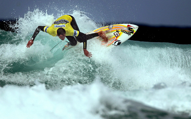 Man riding wave ocean surfboard free wallpaper for desktop - medium preview image