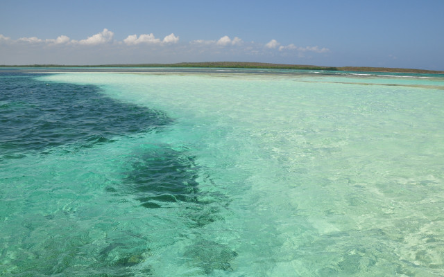 Ocean island boat sky waves free wallpaper for desktop - medium preview image