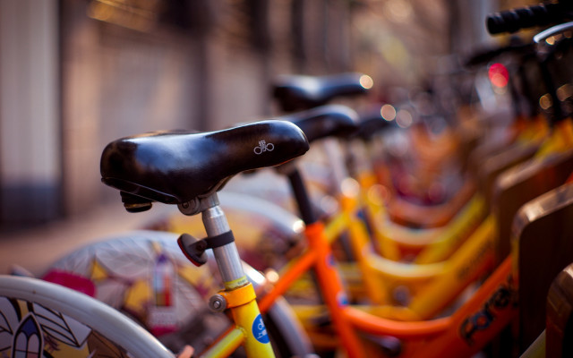 Bicycles sidewalk building blurry shallow free wallpaper for desktop - medium preview image