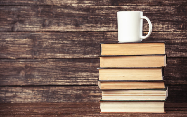 Stack books mug wooden table free wallpaper for desktop - medium preview image