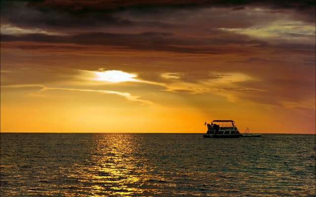 Boat ocean sunset cloudy sky free wallpaper for desktop - medium preview image