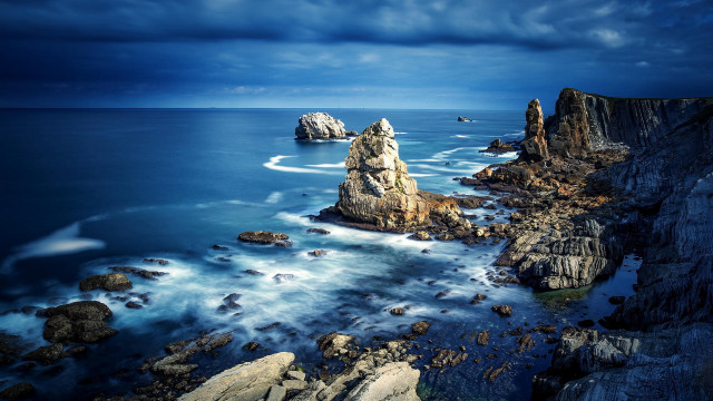 Rocky cliff water boat city free wallpaper for desktop - medium preview image