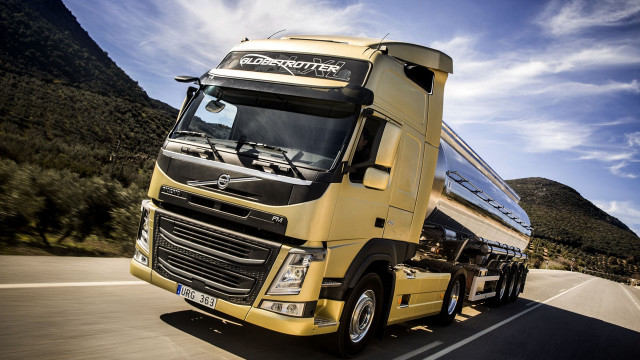 Yellow truck mountain road clouds free wallpaper for desktop - medium preview image