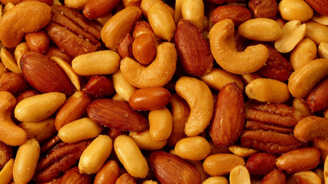 Nuts pile with orange pancake free wallpaper for desktop - medium preview image