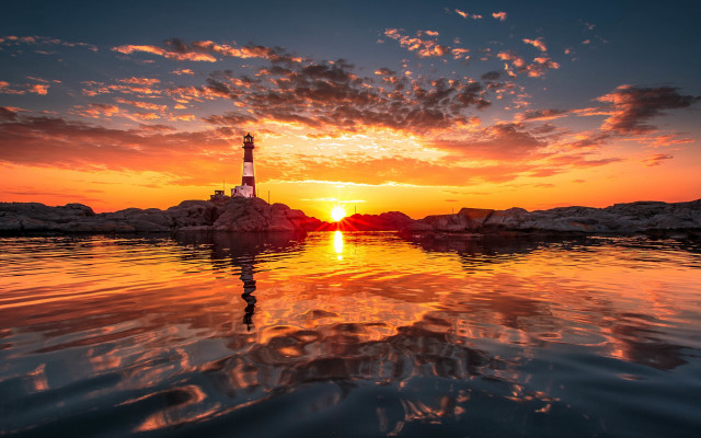 Lighthouse sunset reflection beach water free wallpaper for desktop - medium preview image