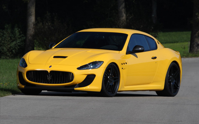 Yellow sports car driving neoclassic free wallpaper for desktop - medium preview image
