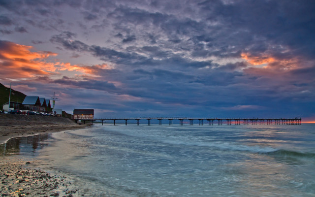 Sunset pier beach waves cloudy free wallpaper for desktop - medium preview image