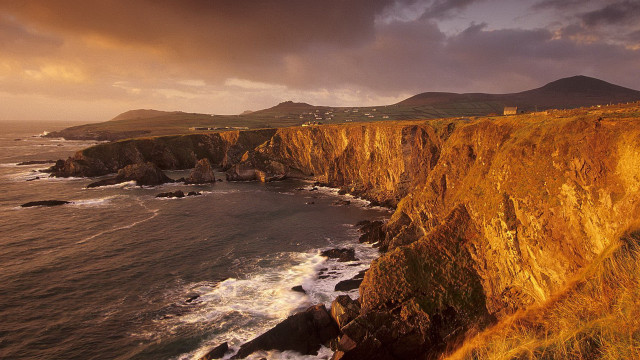 Cliff lighthouse ocean mountains cloudy free wallpaper for desktop - medium preview image