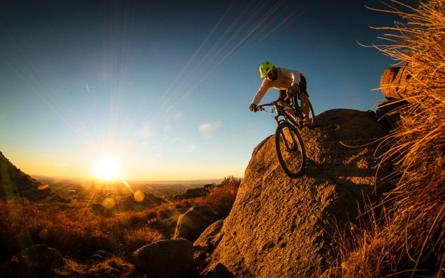 Man bike hillside sunset lens free wallpaper for desktop - medium preview image