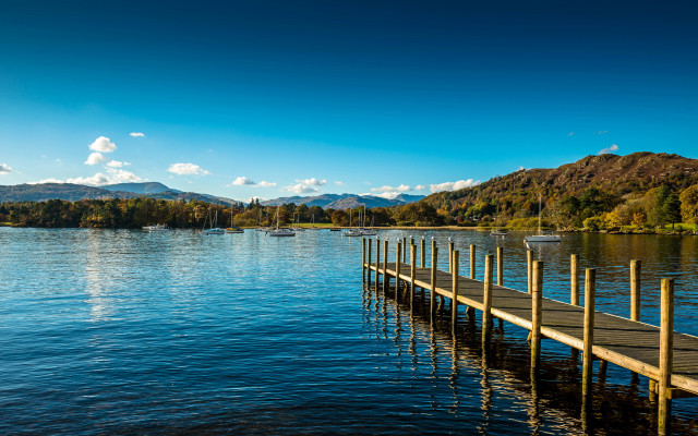 Lake dock mountains blue sky free wallpaper for desktop - medium preview image