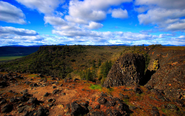 Rocky cliff blue sky clouds free wallpaper for desktop - medium preview image