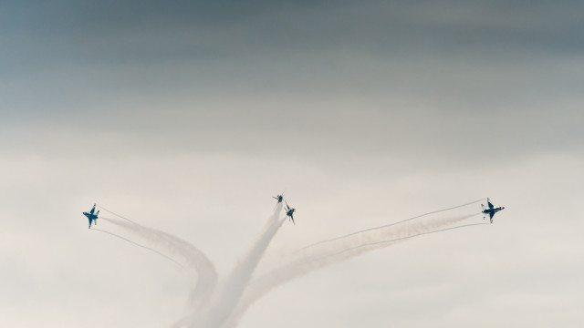 Airplanes cloudy sky smoke trailing free wallpaper for desktop - medium preview image