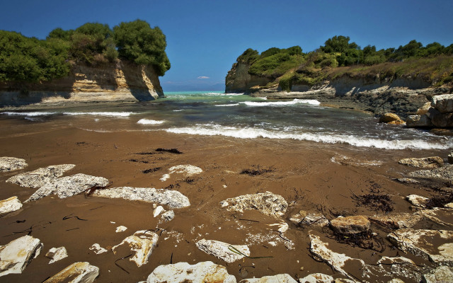 Rocky beach trees water cliff free wallpaper for desktop - medium preview image