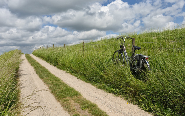Bike fence grass dirt road #2 free wallpaper for desktop - medium preview image