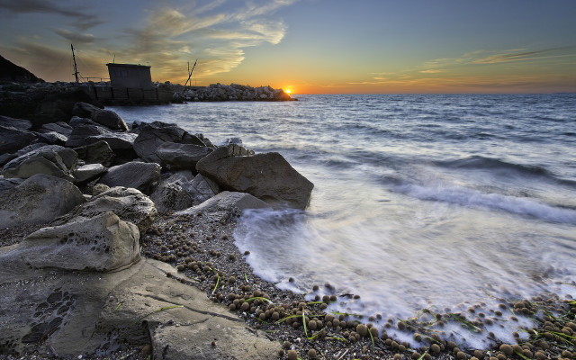Sunset ocean rocky shore city free wallpaper for desktop - medium preview image