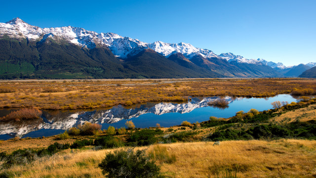 Lush green river mountains sky free wallpaper for desktop - medium preview image