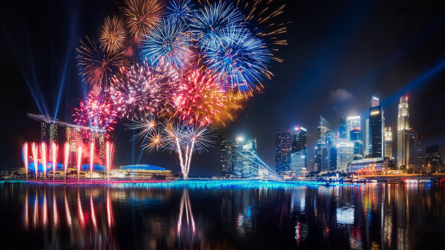 City skyline fireworks reflection night free wallpaper for desktop - medium preview image
