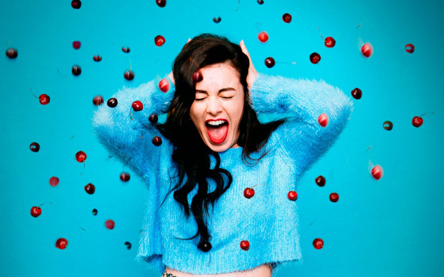 Woman cherries blue background pop free wallpaper for desktop - medium preview image