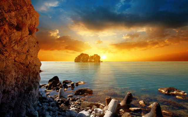 Sunset rocky beach island foreground free wallpaper for desktop - medium preview image