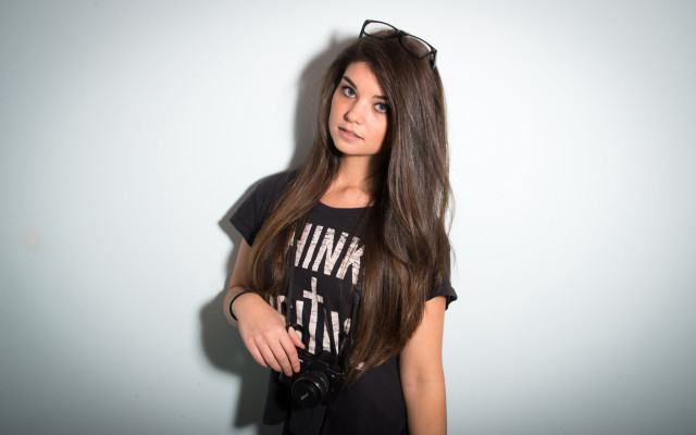 Woman glasses longhair camera portrait free wallpaper for desktop - medium preview image