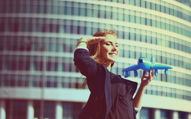Woman toy airplane glass building free wallpaper for desktop - medium preview image
