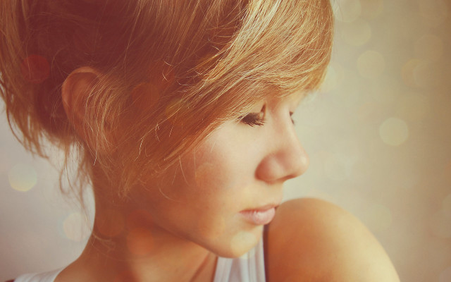 Woman messybun lookingdown closeup realistic #2 free wallpaper for desktop - medium preview image