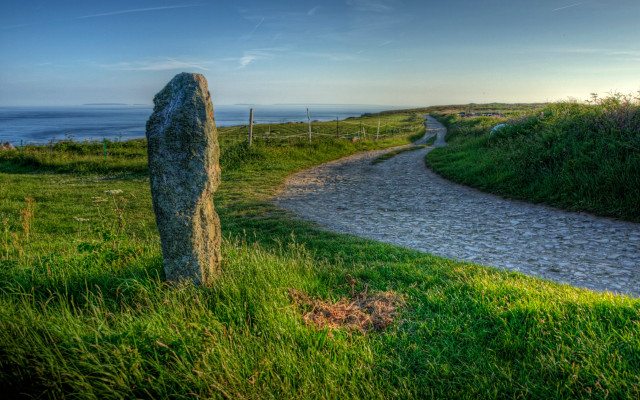 Stone marker grassy path ocean free wallpaper for desktop - medium preview image