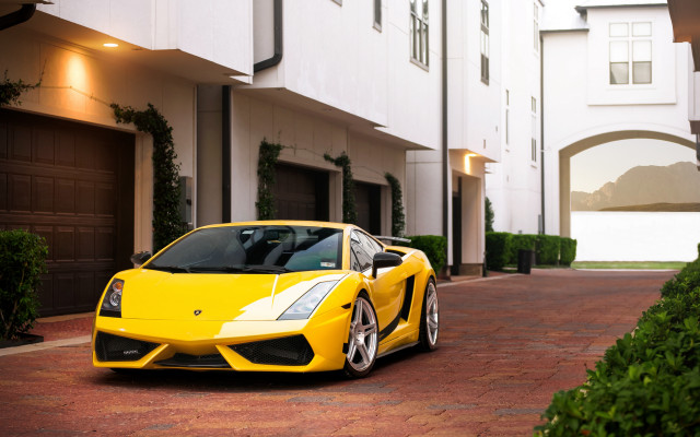 Yellow sports car building driveway free wallpaper for desktop - medium preview image