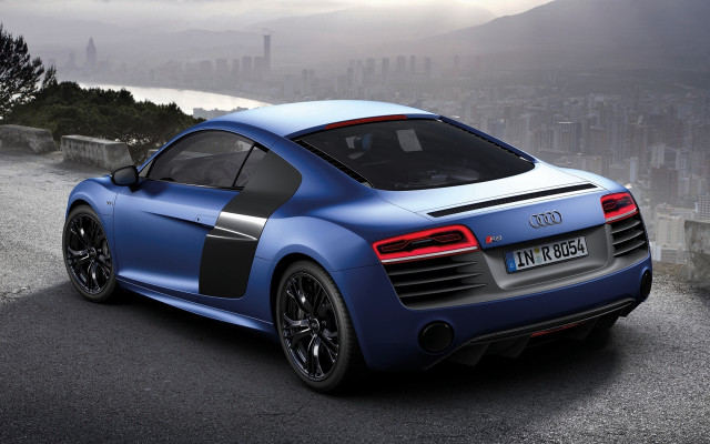 Blue sports car city mountain free wallpaper for desktop - medium preview image