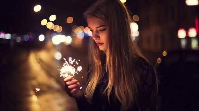 Woman sparkler night street christmas free wallpaper for desktop - medium preview image