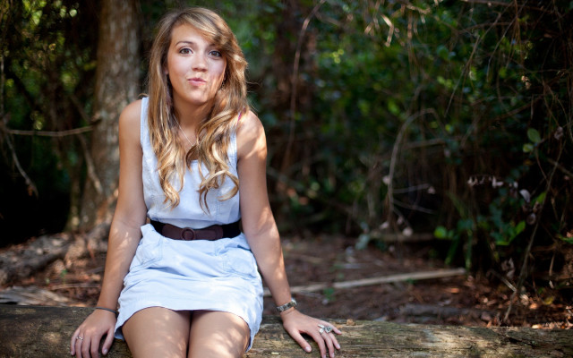 Woman forest smiling sitting dappled free wallpaper for desktop - medium preview image