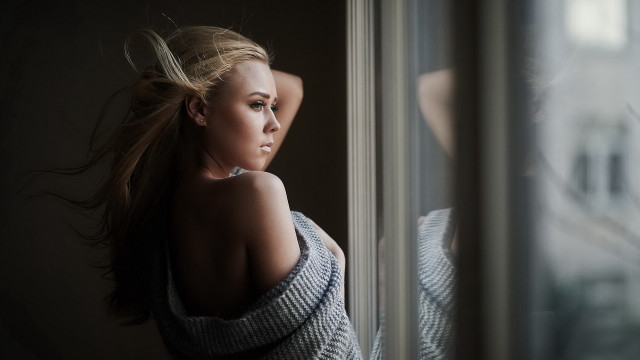 Woman leaning window blonde blurry free wallpaper for desktop - medium preview image