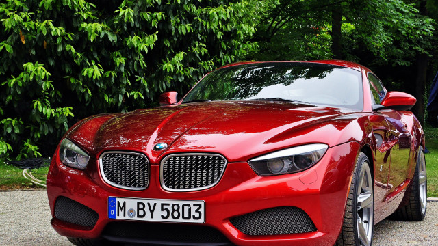 Red sports car parked tree free wallpaper for desktop - medium preview image