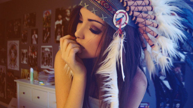 Woman feather headdress leaning dresser free wallpaper for desktop - medium preview image
