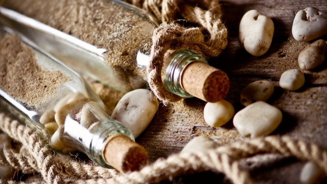 Bottles sand rocks rope stilllife free wallpaper for desktop - medium preview image