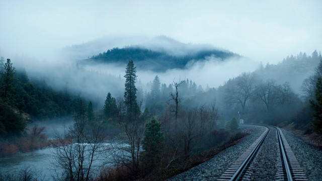 Foggy train track mountains trees free wallpaper for desktop - medium preview image
