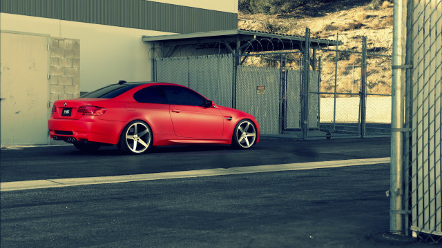 Red car building street fence free wallpaper for desktop - medium preview image