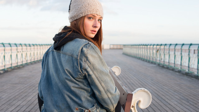 Woman denim jacket skateboard ocean free wallpaper for desktop - medium preview image