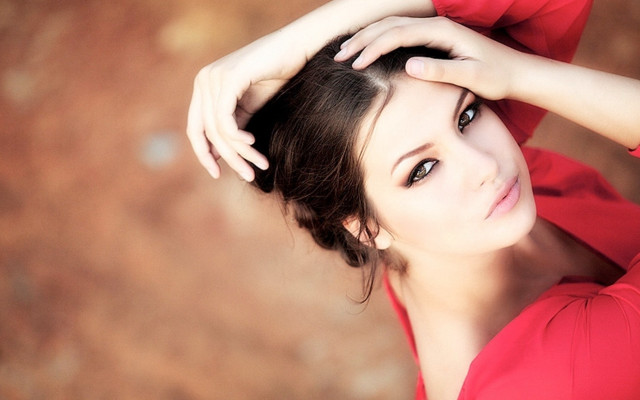 Woman red top hands head free wallpaper for desktop - medium preview image