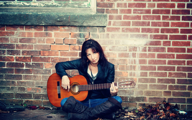 Woman guitar brick wall portrait free wallpaper for desktop - medium preview image