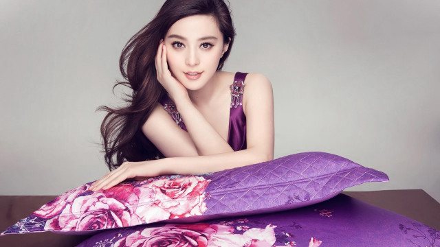 Woman purple flower pillow portrait free wallpaper for desktop - medium preview image