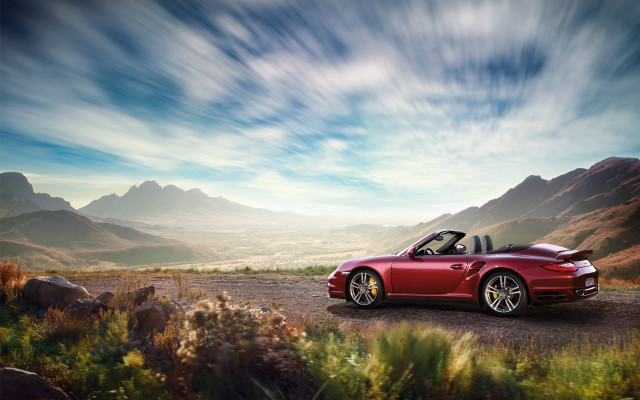 Red sports car mountains dirt free wallpaper for desktop - medium preview image